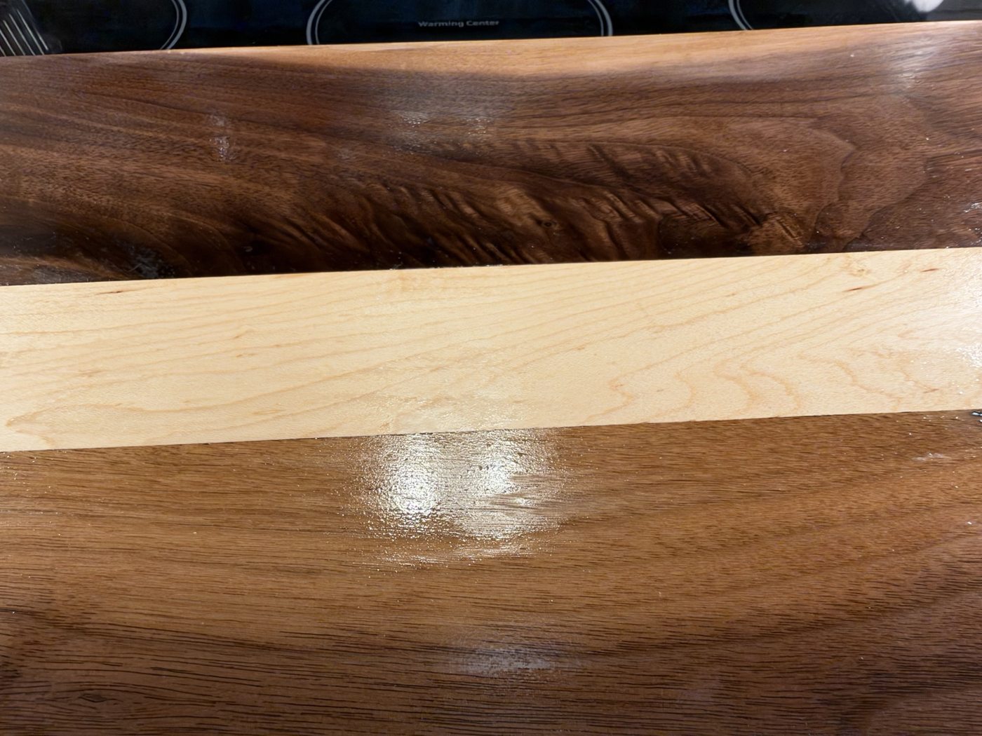 Close-up of wood grain and contrasting wood strip